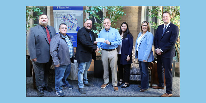 Midwest Energy presents a check to CCC.