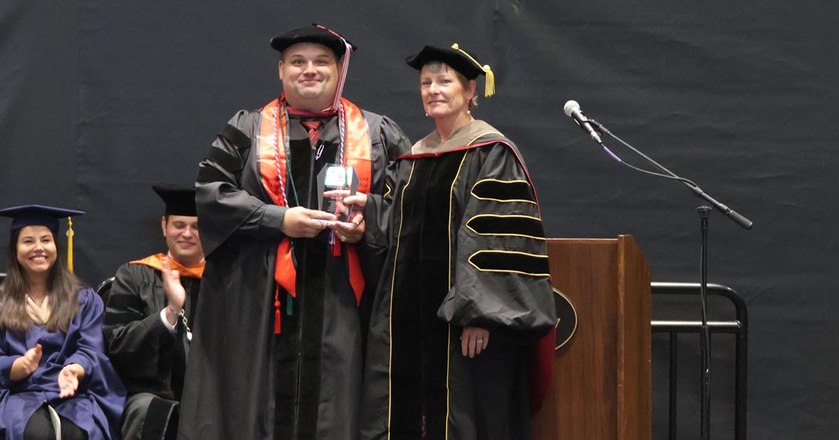 Dr. Joan Johnson, right, receives the Tangeman Award for Teaching Excellence from STEM Division Chair Dr. Jeffrey Sekavec.