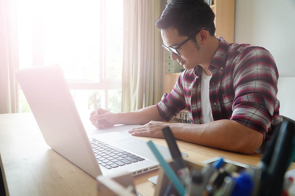 Student using a laptop for online coursework.